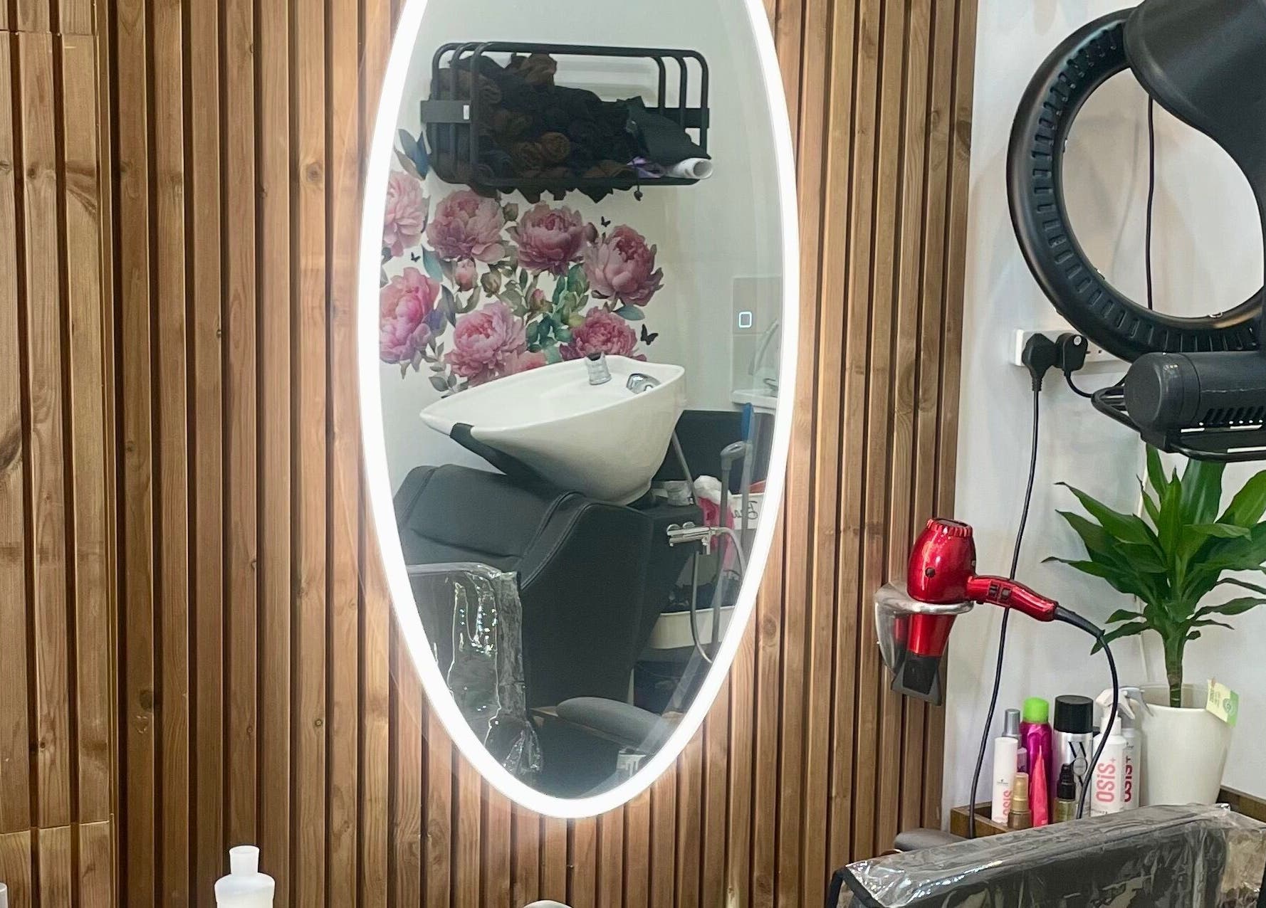 Elegant salon station with round mirror at Eliabeautystudio Ladies HairSalon, Wembley, England, GB.