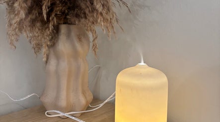A calming diffuser beside pampas grass at hattieXhair, Worcester, England, GB.