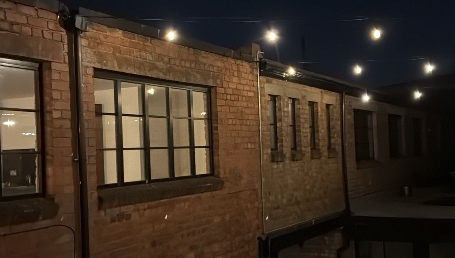 Kluxr Aesthetics exterior with string lights in Birmingham, England, GB.