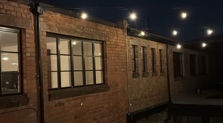 Kluxr Aesthetics exterior with string lights in Birmingham, England, GB.