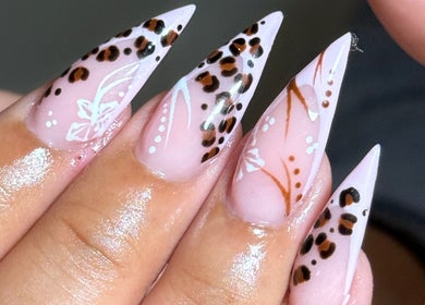 Stylish leopard print nail design at Kluxr Aesthetics, Birmingham, England, GB. Perfect for a chic look.
