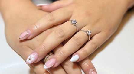 Stylish pink manicure with rings at Kluxr Aesthetics, Birmingham, England, GB.
