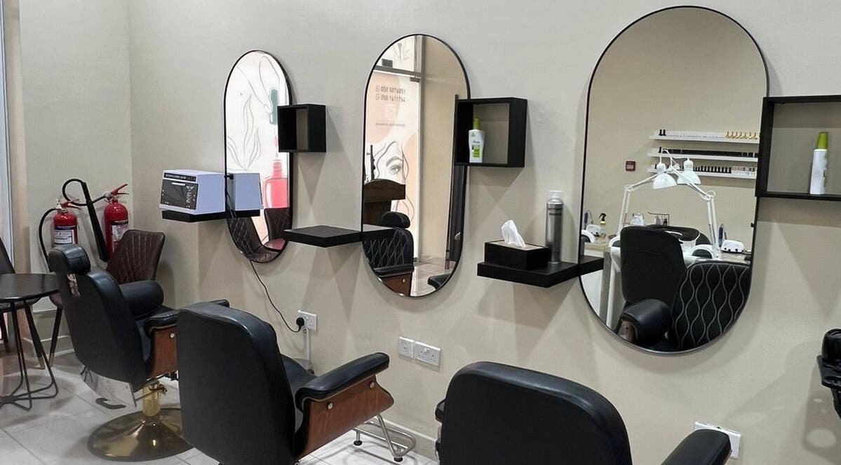 Modern salon chairs and mirrors at AL JAMAL AL SATEE BEAUTY CENTER, Sharjah, Sharjah, AE.