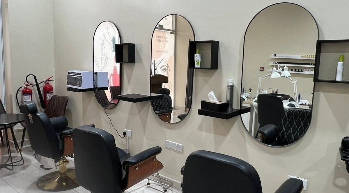 Modern salon chairs and mirrors at AL JAMAL AL SATEE BEAUTY CENTER, Sharjah, Sharjah, AE.