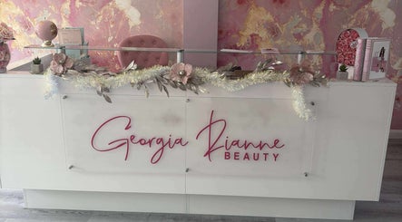 Chic reception area at TJ Nails & Beauty, Ripley, England, GB featuring a white desk with decorative floral accents.