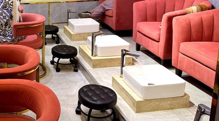 Luxurious pedicure setup at GIGI BEAUTY CENTER, Dubai, Dubai, AE with plush seating and marble basins.