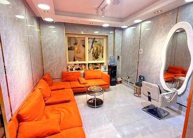GIGI BEAUTY CENTER lounge with orange seating, chic mirror, Dubai, Dubai, AE.