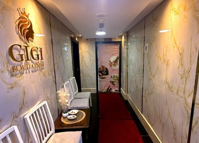 Entrance hallway of GIGI BEAUTY CENTER, featuring chic decor and seating, located in Dubai, Dubai, AE.