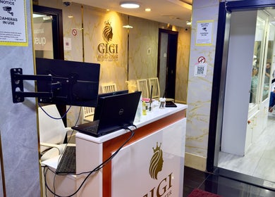 Elegant reception area at GIGI BEAUTY CENTER, Dubai, Dubai, AE with modern decor and cozy ambiance.