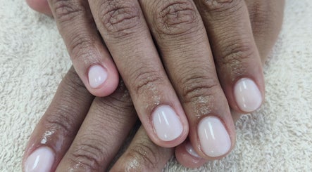 Well-manicured nails with glossy finish at Cassie's Beauty Therapy in Bude, England, GB.
