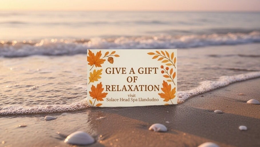 Gift card on the beach for Solace Head Spa in Llandudno, Wales, GB, promoting relaxation.