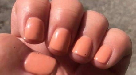Close-up of peach manicured nails by Krystyn's Mobile Spa in Barrie, Ontario, CA showcasing expert nail care.