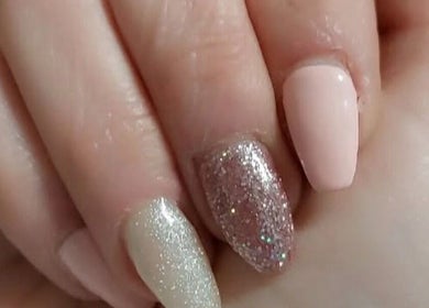 Elegant glitter and nude manicure from Krystyn's Mobile Spa, Barrie, Ontario, CA showcasing expert nail artistry.