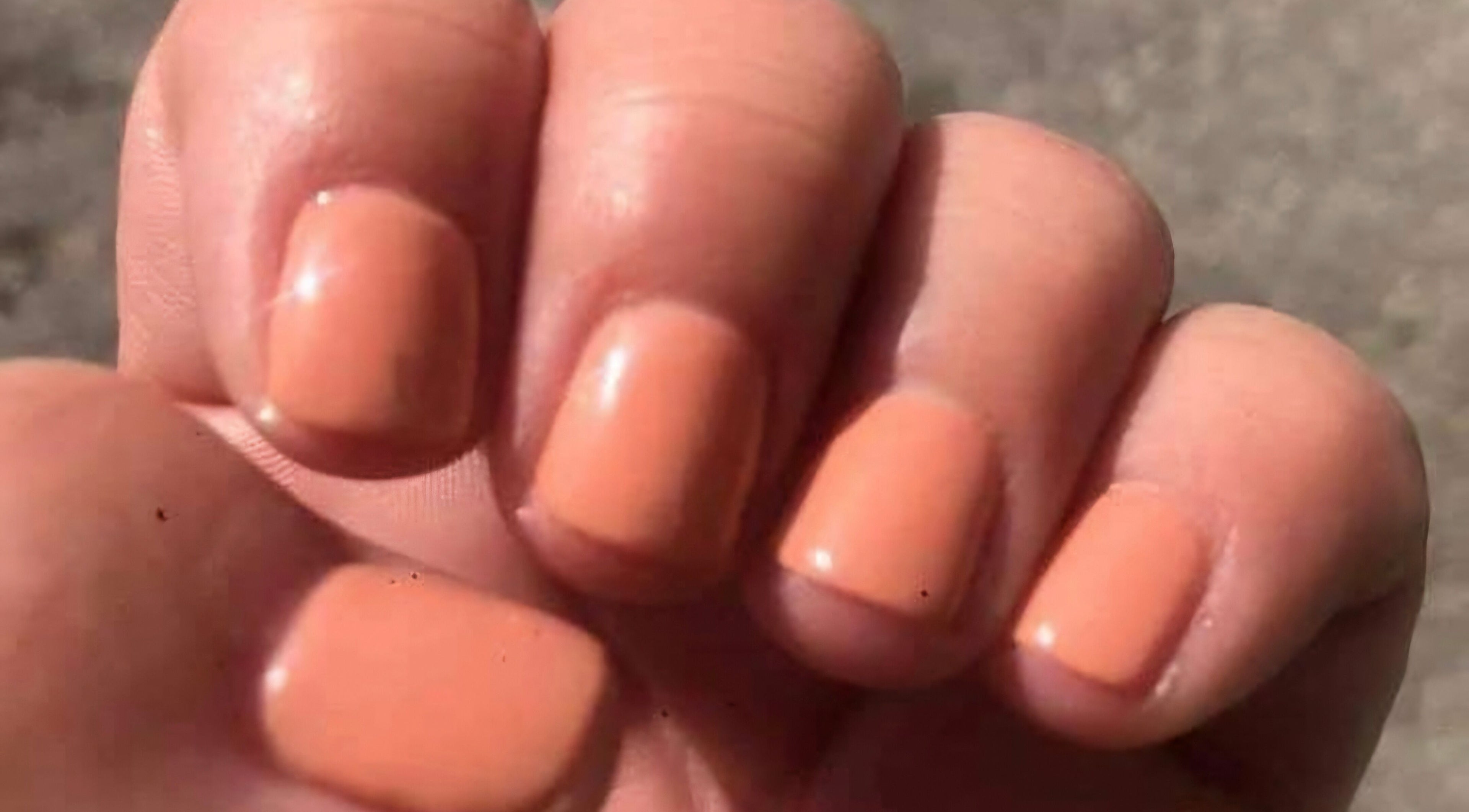 Peach manicure from Krystyn's Mobile Spa in Barrie, Ontario, CA, showcasing polished style.