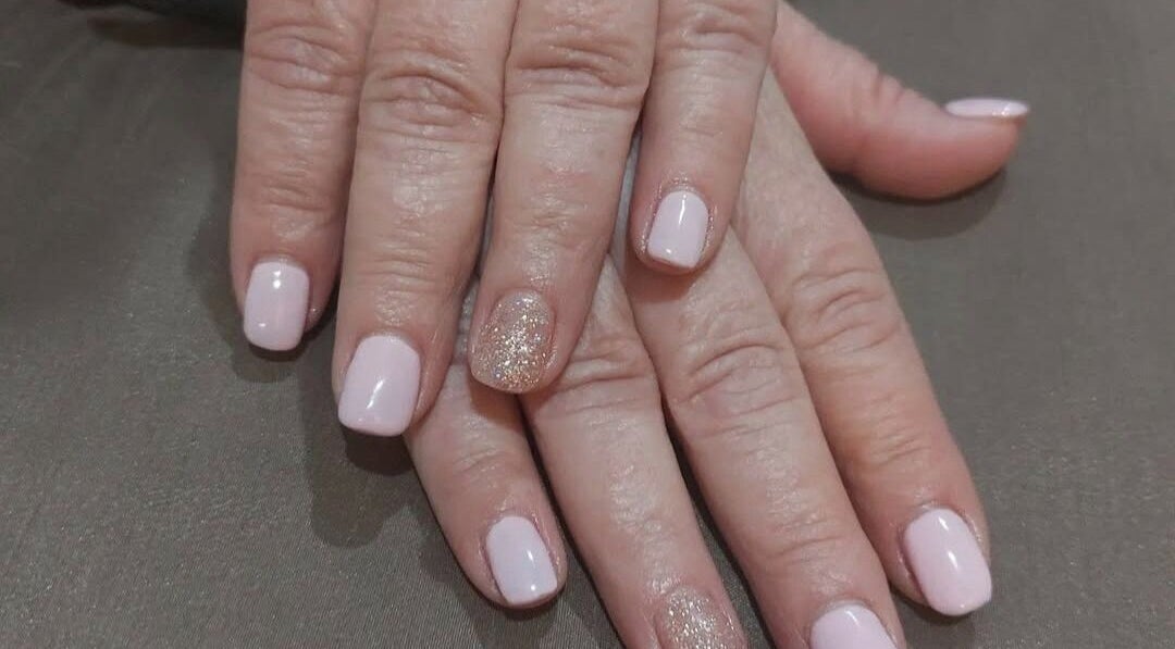 Delicate nude and glitter manicure at Krystyn's Mobile Spa, Barrie, Ontario, CA.