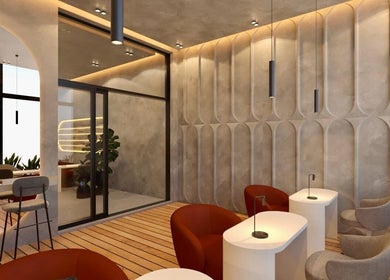 Interior moderno de Qōre - the nail haus en Guatemala, GT, con paredes geométricas y asientos elegantes.