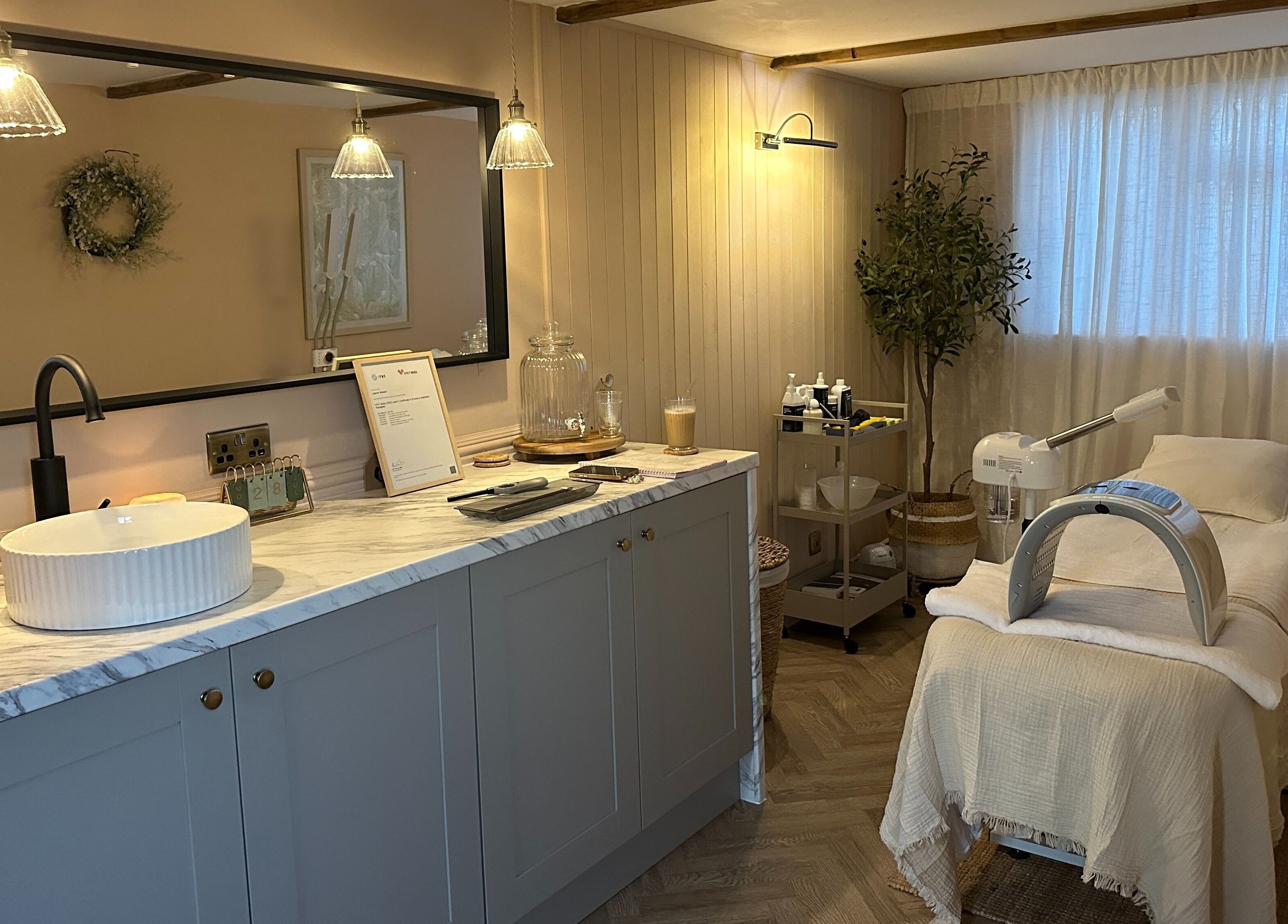 Cozy treatment room at Bare Willow Skin Clinic in Hinckley, England, GB with modern decor and soft lighting.