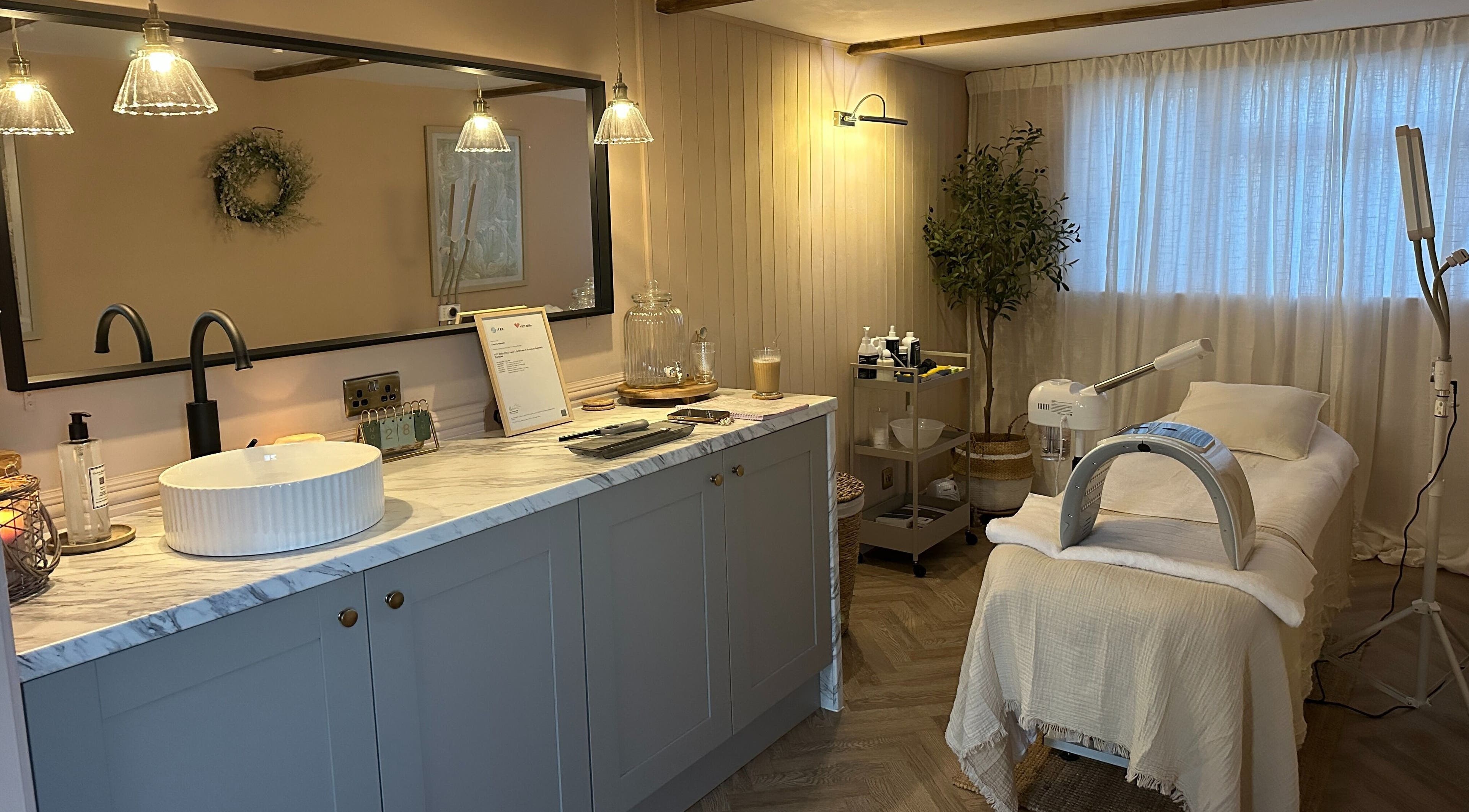 Cozy treatment room at Bare Willow Skin Clinic in Hinckley, England, GB with modern decor and soft lighting.