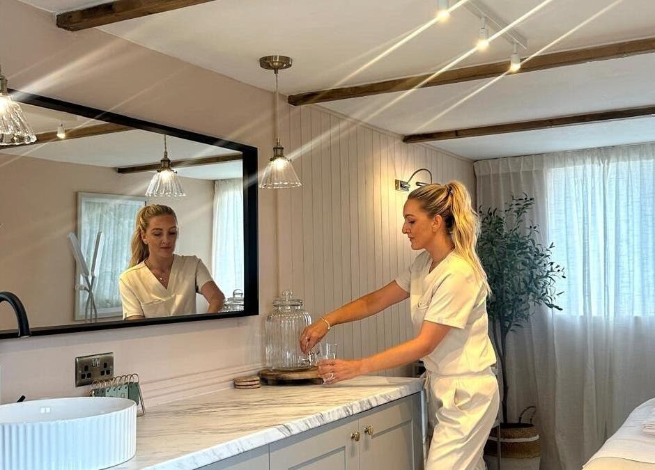 Staff at Bare Willow Skin Clinic, Hinckley, England, GB, preparing a serene treatment room.