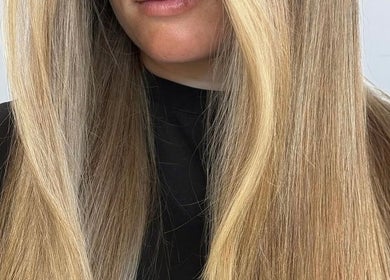 Close-up of sleek blonde hair styled at HAUS OF BLONDE in Poway, California, US.