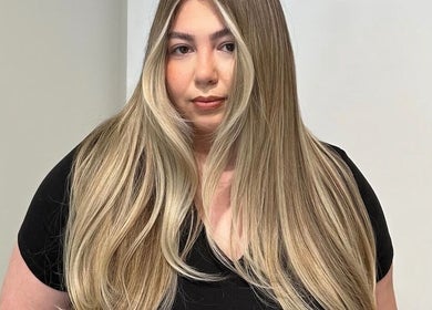 A woman with long, blonde hair at HAUS OF BLONDE, Poway, California, US.
