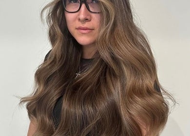 Brunette hair styled in soft waves at HAUS OF BLONDE, Poway, California, US.
