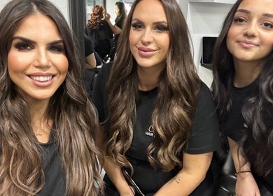 Clients smiling at TE Luxx Hair Studio, Padstow, New South Wales, AU, showcasing elegant hairstyles.