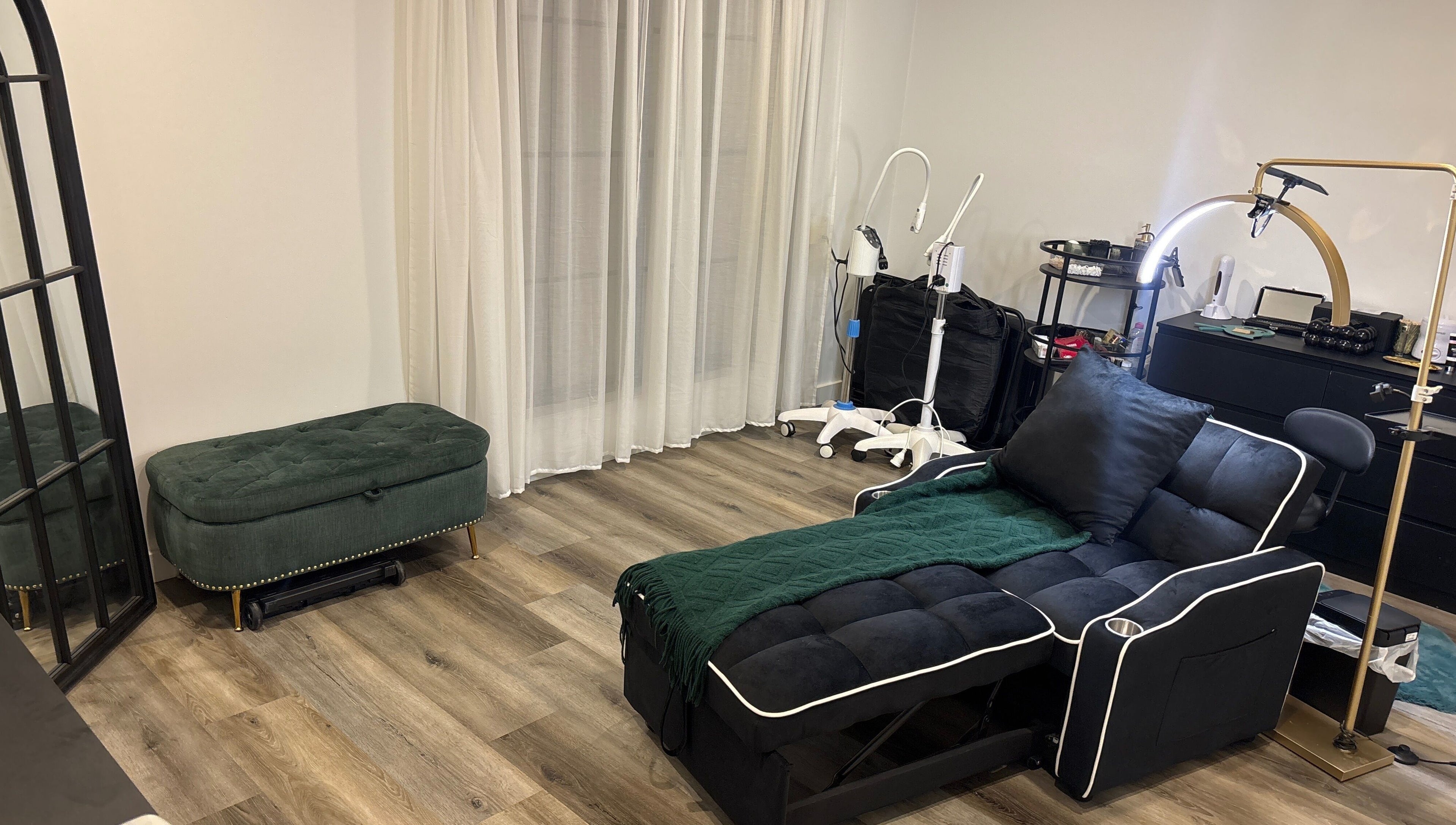 Luxurious beauty room at DĀNA X BEAUTY, Liverpool, New South Wales, AU with plush seating and modern equipment.