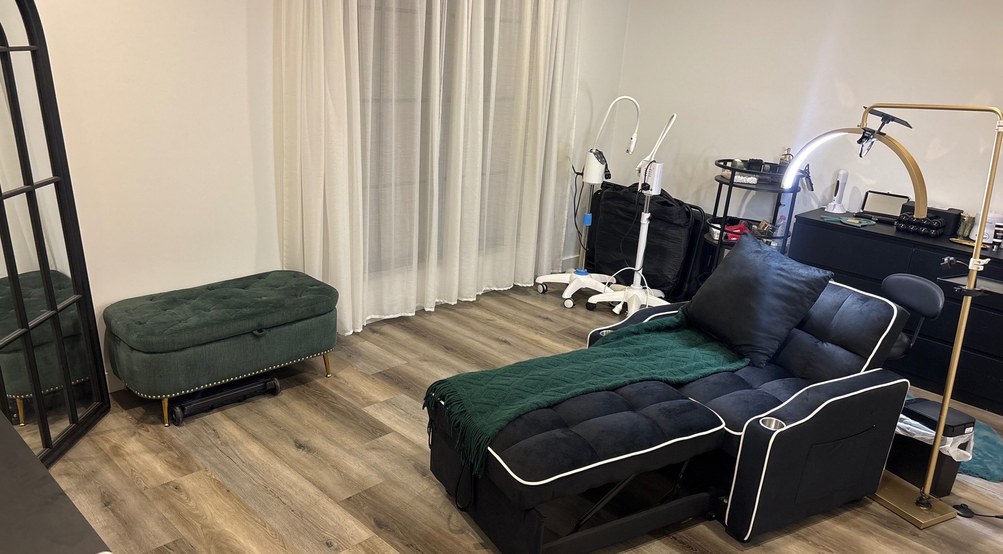 Luxurious beauty room at DĀNA X BEAUTY, Liverpool, New South Wales, AU with plush seating and modern equipment.