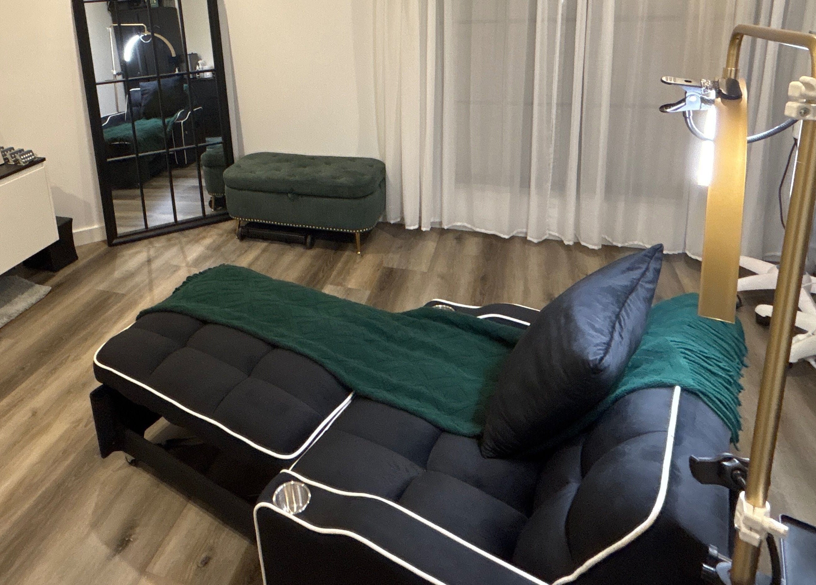 Luxe beauty room at DĀNA X BEAUTY, Liverpool, New South Wales, AU, with plush seating and elegant decor.