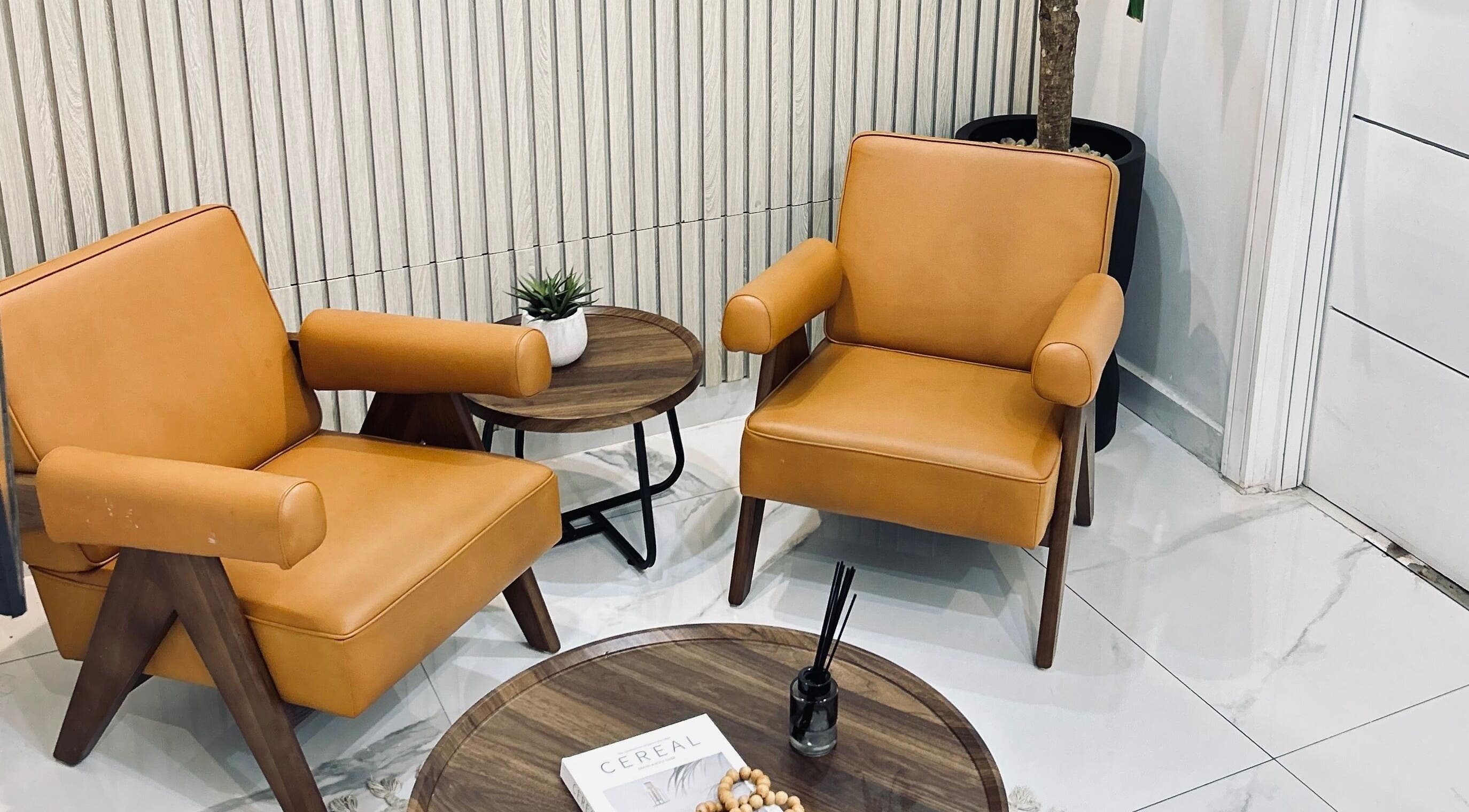 Stylish lounge area at VCP Laser and Aesthetics Clinic & Spa, Lagos, Lagos, NG, featuring leather chairs and chic decor.