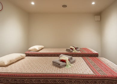 Twin massage beds at Even Thai Spa, London, England. Experience relaxation in a serene setting.