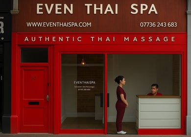 Entrance of Even Thai Spa in London, England, GB featuring bold red facade and welcoming staff.