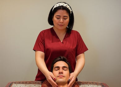 Therapist at Even Thai Spa provides a calming massage in London, England, GB.