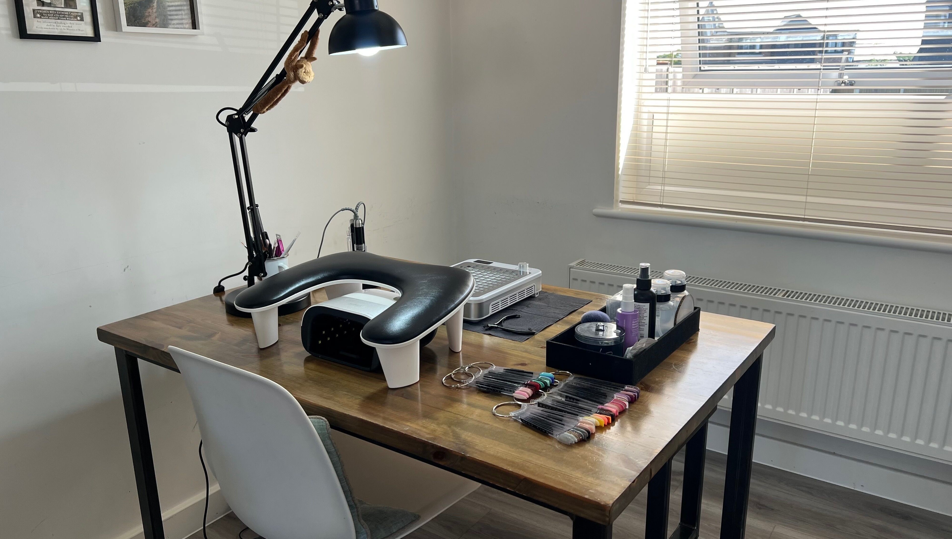 Professional nail workspace at Simply Nails by Jess, Margate, England, GB, featuring manicure tools and products.