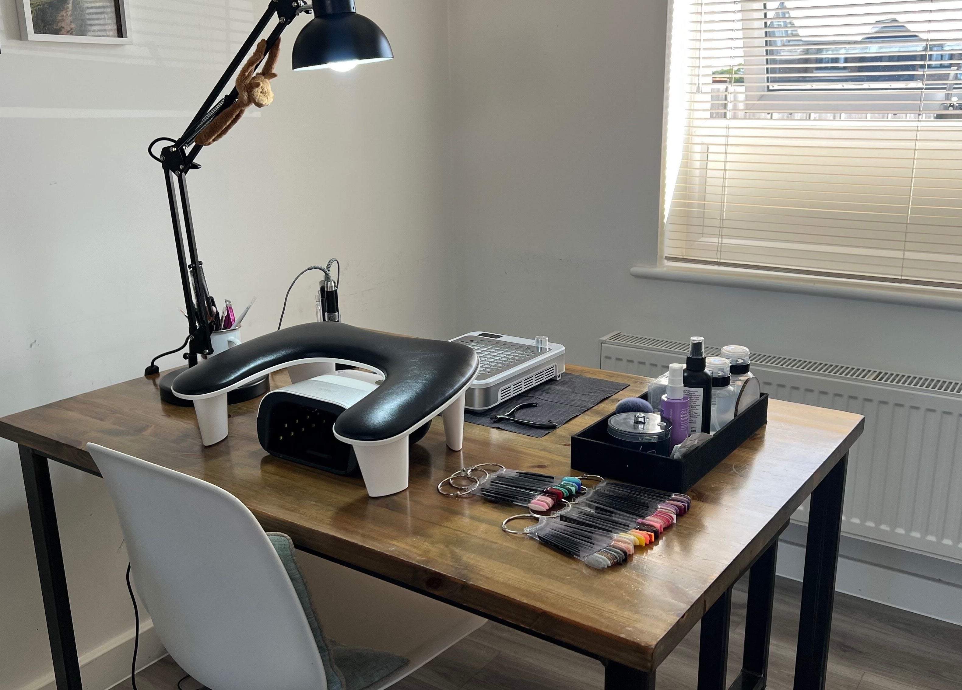 Professional nail workspace at Simply Nails by Jess, Margate, England, GB, featuring manicure tools and products.