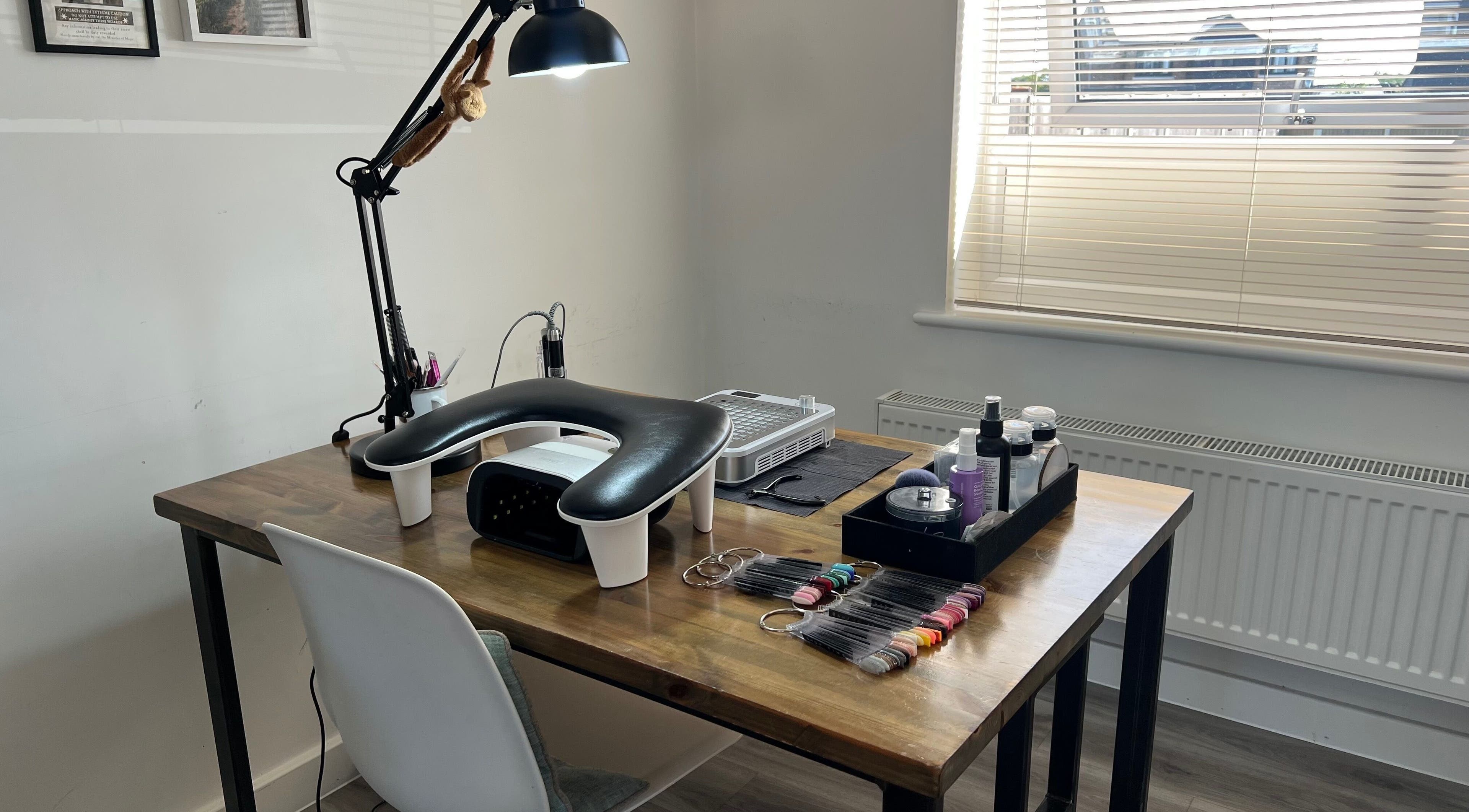 Professional nail workspace at Simply Nails by Jess, Margate, England, GB, featuring manicure tools and products.
