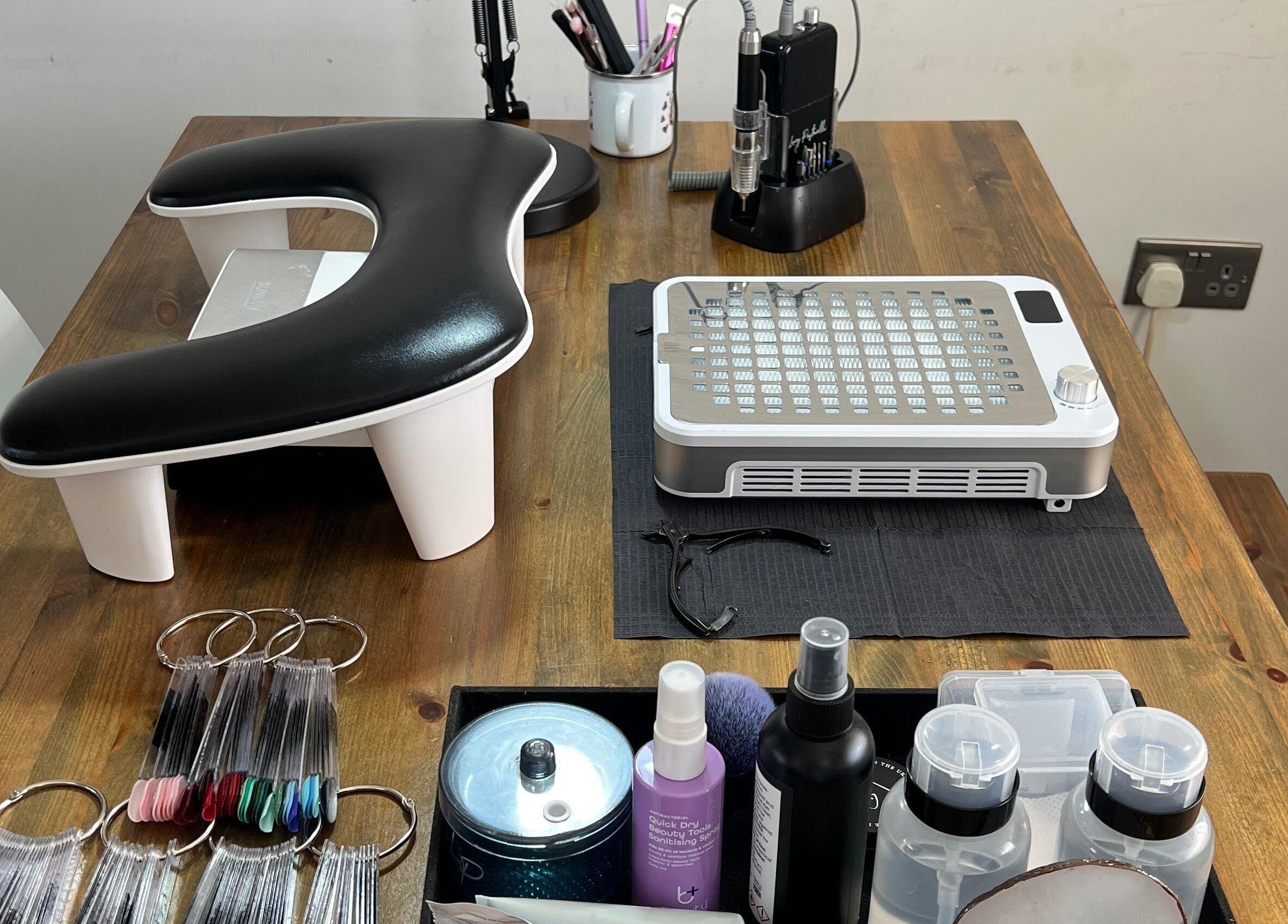 Simply Nails by Jess, Margate, England, GB nail care tools on wooden table for a premium salon experience.