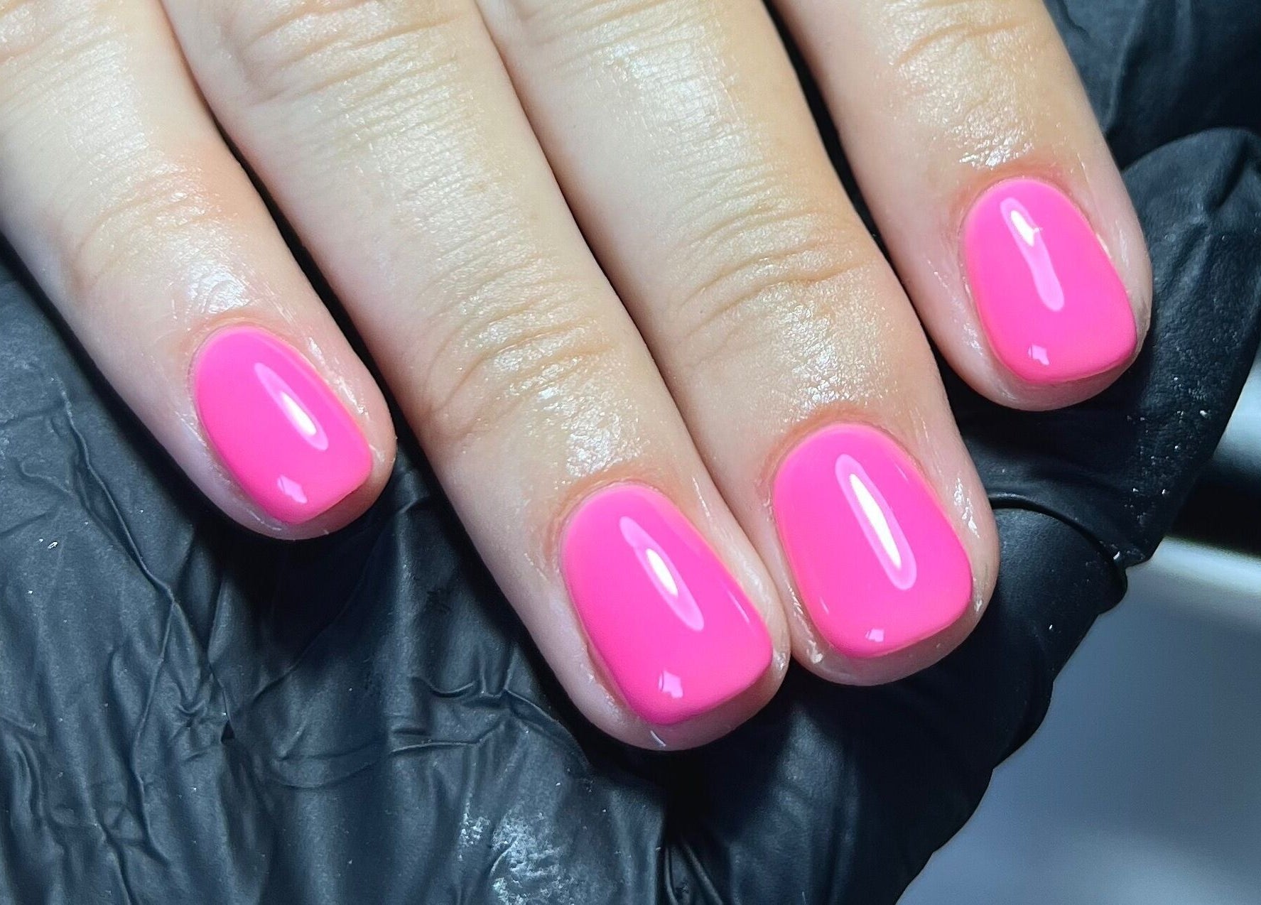 Bright pink manicure at Simply Nails by Jess, Margate, England, GB. Perfectly polished and styled.