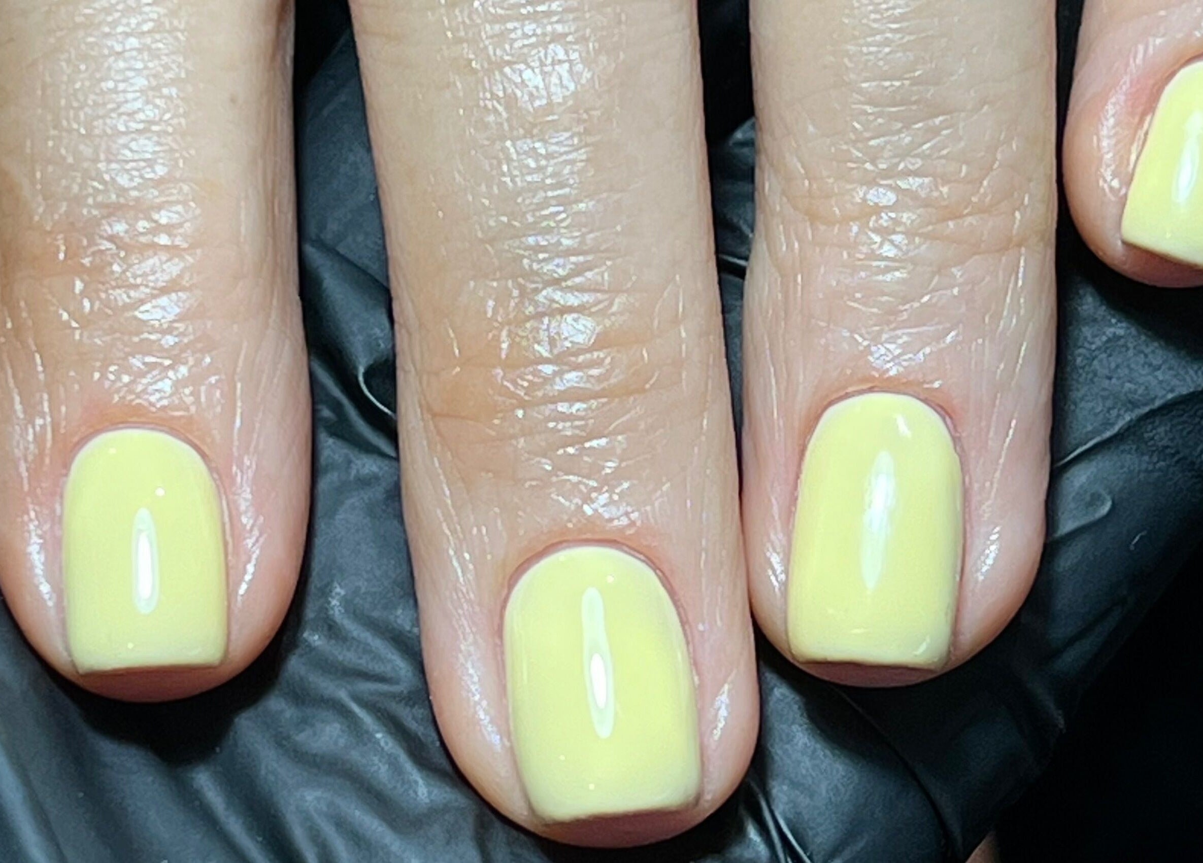 Yellow manicured nails at Simply Nails by Jess, Margate, England, GB, showcasing vibrant style.