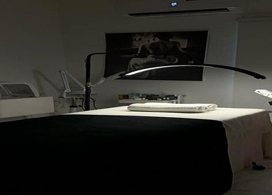 Relaxing spa room at The Bougie & Co in Lagos, Lagos, NG with massage bed and soft lighting.