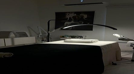 Relaxing spa room at The Bougie & Co in Lagos, Lagos, NG with massage bed and soft lighting.