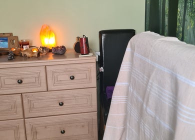 Peaceful therapy room at Offas Dyke Reflexology, Trefonen, England, GB with soft lighting and natural decor.