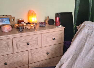 Cozy therapy room at Offas Dyke Reflexology, Trefonen, with ambient lighting and natural decor.