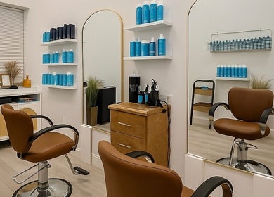 Modern salon chair and mirrors in Deep Roots Hair Atelier, Riverhead, New York, US.