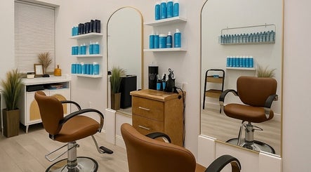 Modern salon chair and mirrors in Deep Roots Hair Atelier, Riverhead, New York, US.
