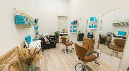 Modern salon interior at Deep Roots Hair Atelier, Riverhead, New York, US with stylish chairs and decor.