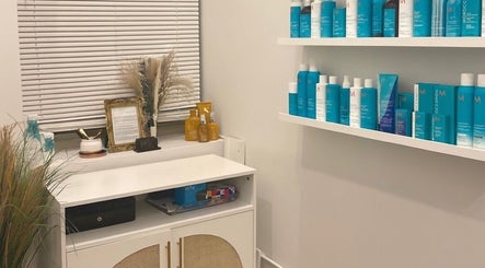 Product display at Deep Roots Hair Atelier in Riverhead, New York, US, featuring quality hair care products.
