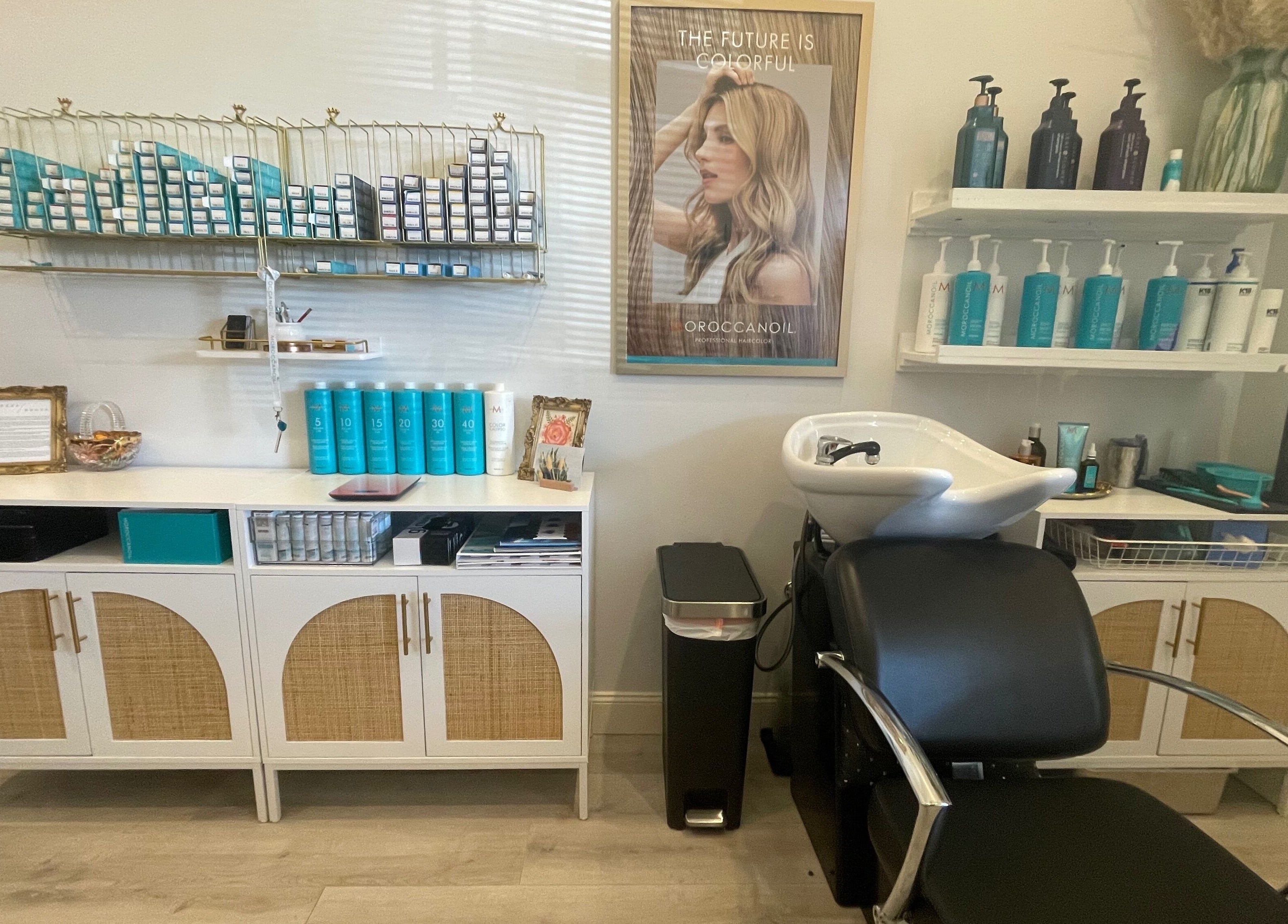 Stylish salon interior of Deep Roots Hair Atelier in Riverhead, New York, US, showcasing premium hair products.