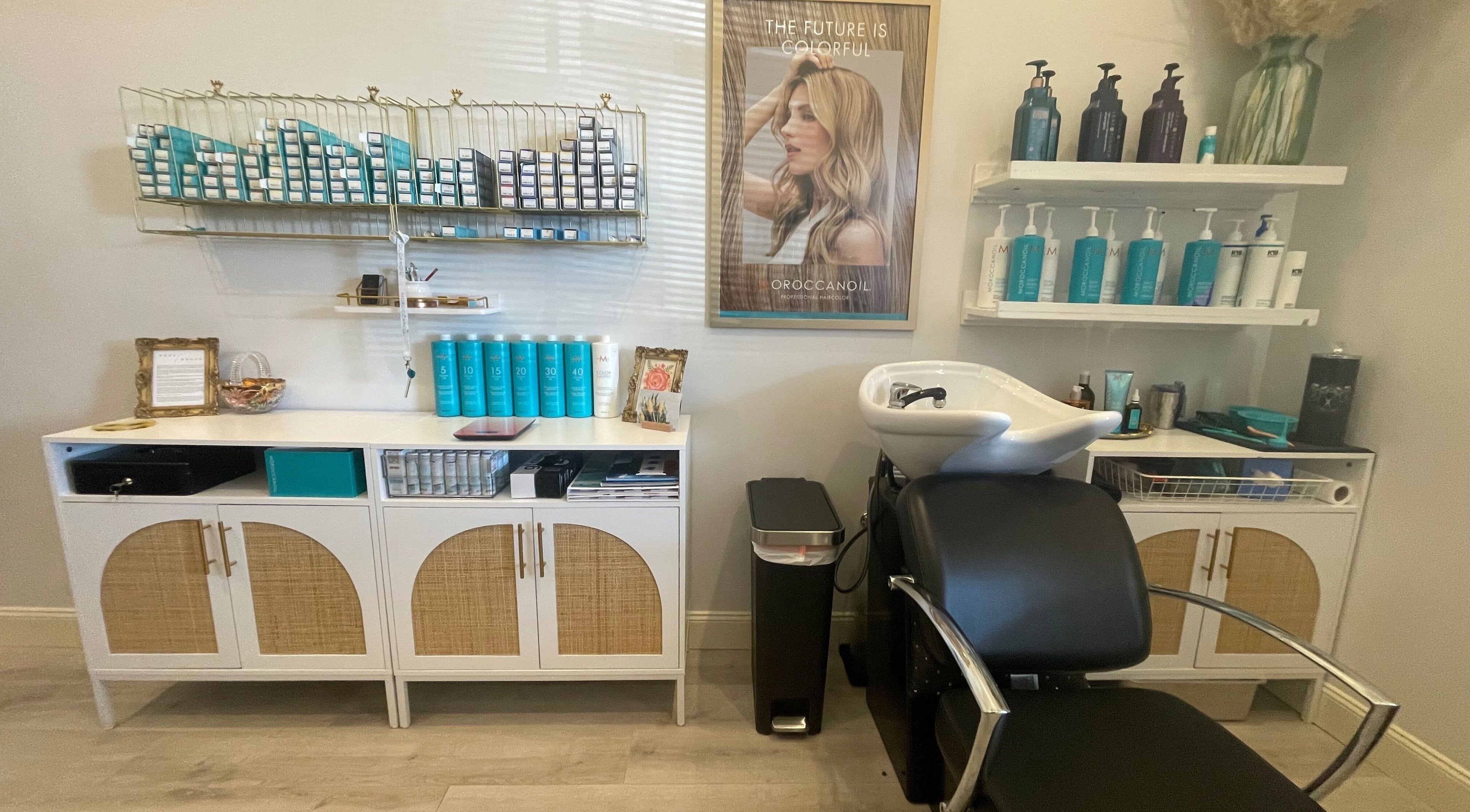 Stylish salon interior of Deep Roots Hair Atelier in Riverhead, New York, US, showcasing premium hair products.